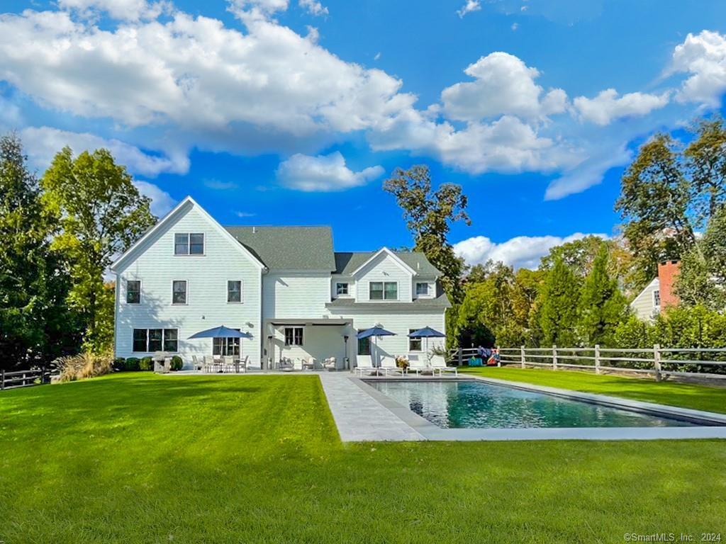 17 Stony Brook Road Westport, CT 06880 - Photo 29 of 39 a view of a house with a big yard and potted plants