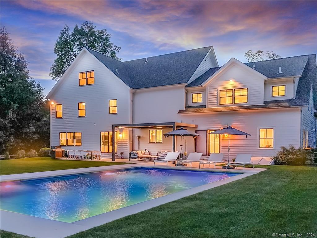 17 Stony Brook Road Westport, CT 06880 - Photo 30 of 39 a front view of a house with a swimming pool