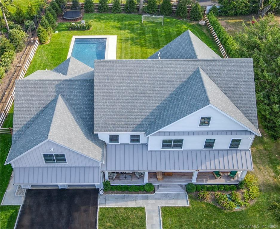 17 Stony Brook Road Westport, CT 06880 - Photo 31 of 39 a view of a house with wooden fence and a yard