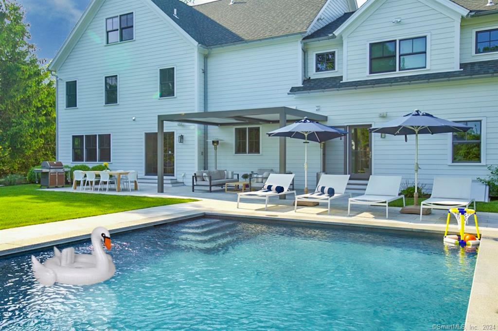 17 Stony Brook Road Westport, CT 06880 - Photo 33 of 39 a view of a house with swimming pool and a yard