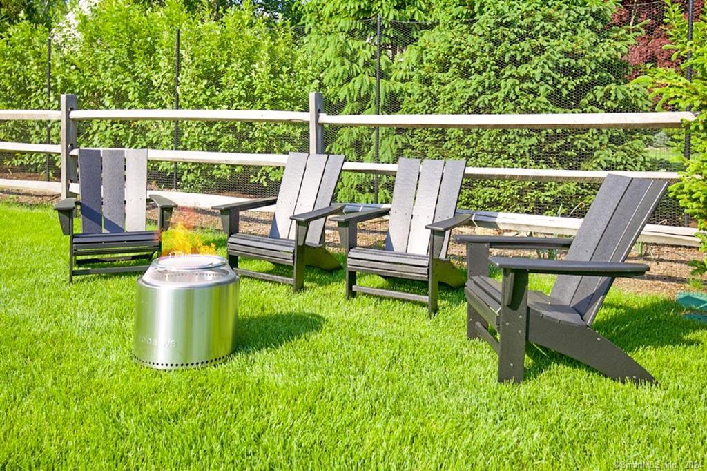 17 Stony Brook Road Westport, CT 06880 - Photo 39 of 39 a view of a chair and table in the garden