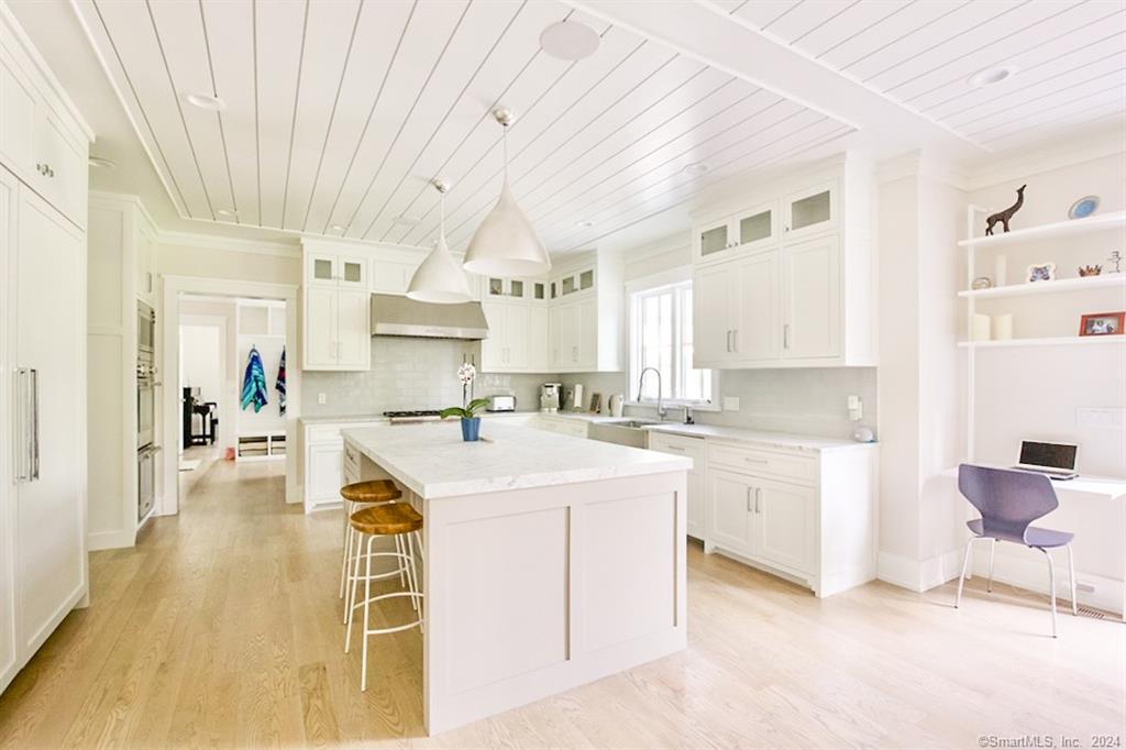 17 Stony Brook Road Westport, CT 06880 - Photo 4 of 39 a large white kitchen with cabinets