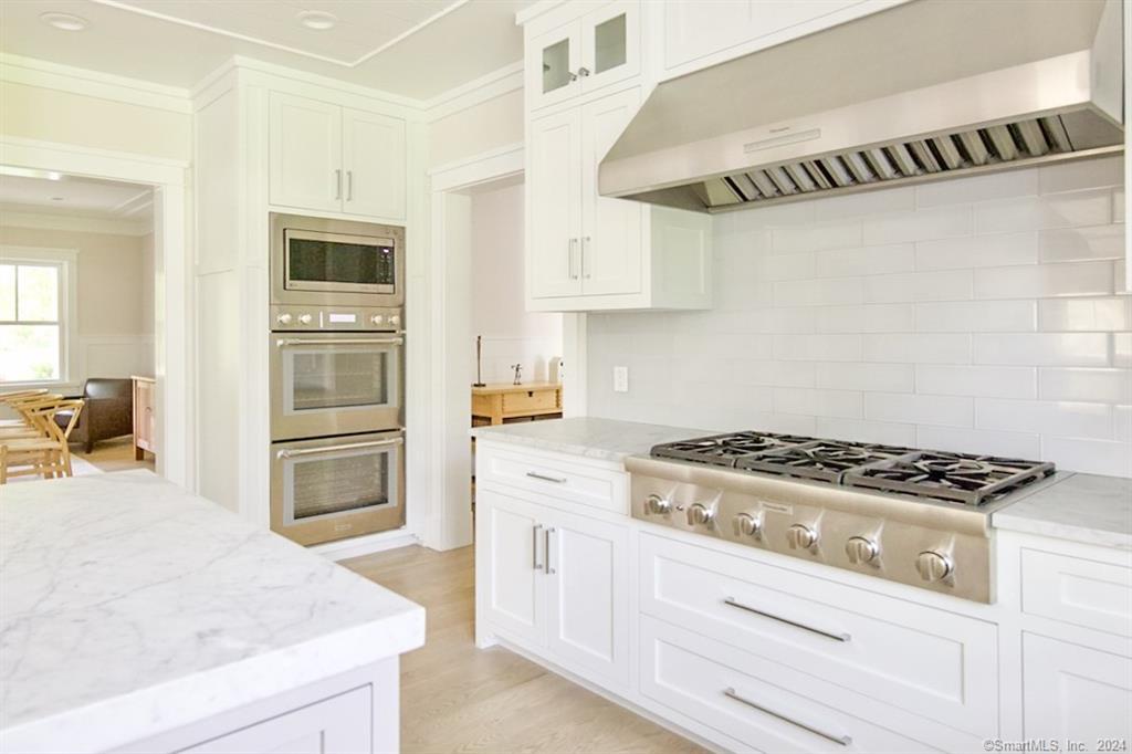 17 Stony Brook Road Westport, CT 06880 - Photo 5 of 39 a kitchen with cabinets and appliances