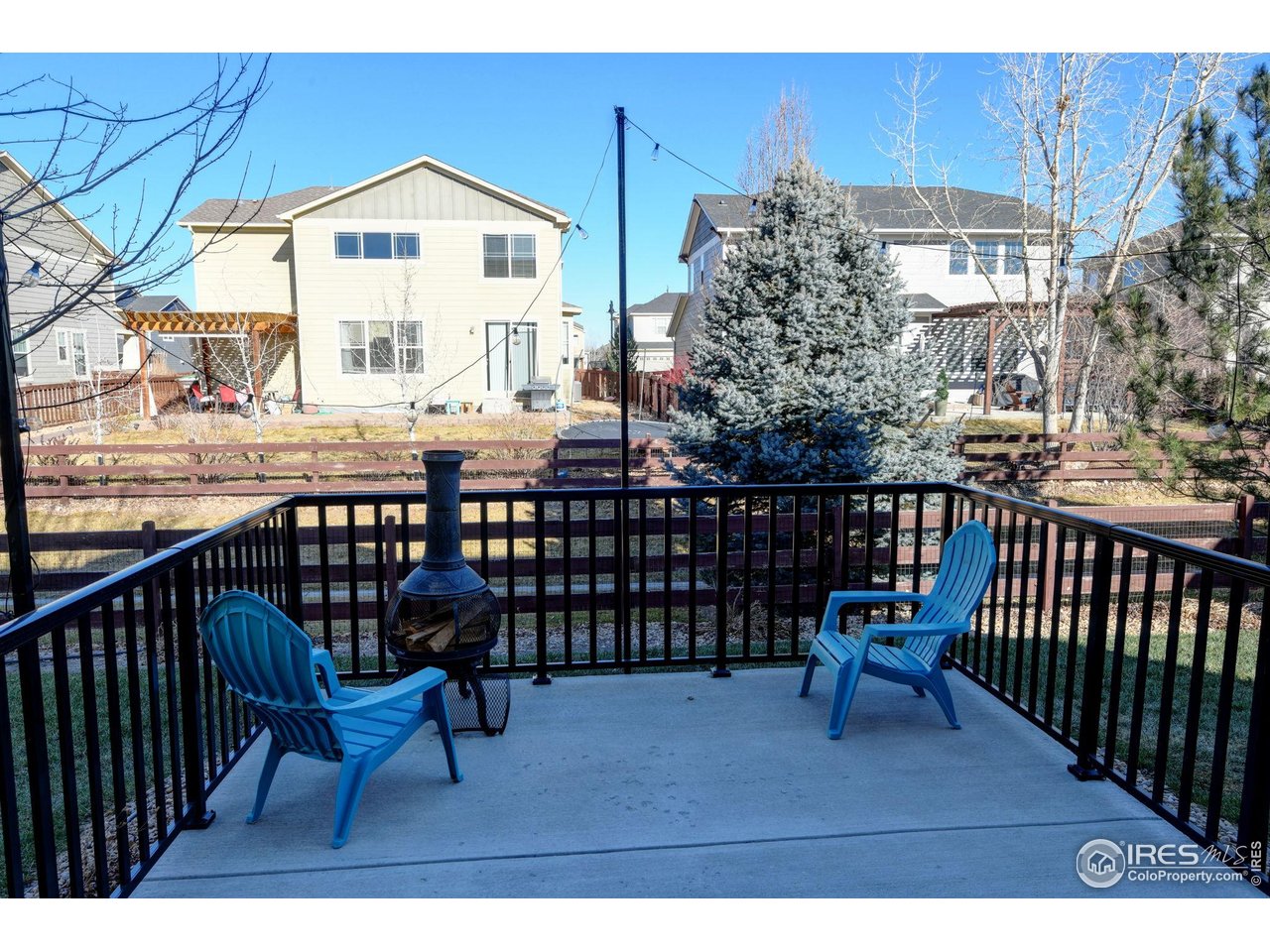 6770 Spring Rain Road Timnath, CO 80547 - Photo 37 of 50 back deck with fenced yard