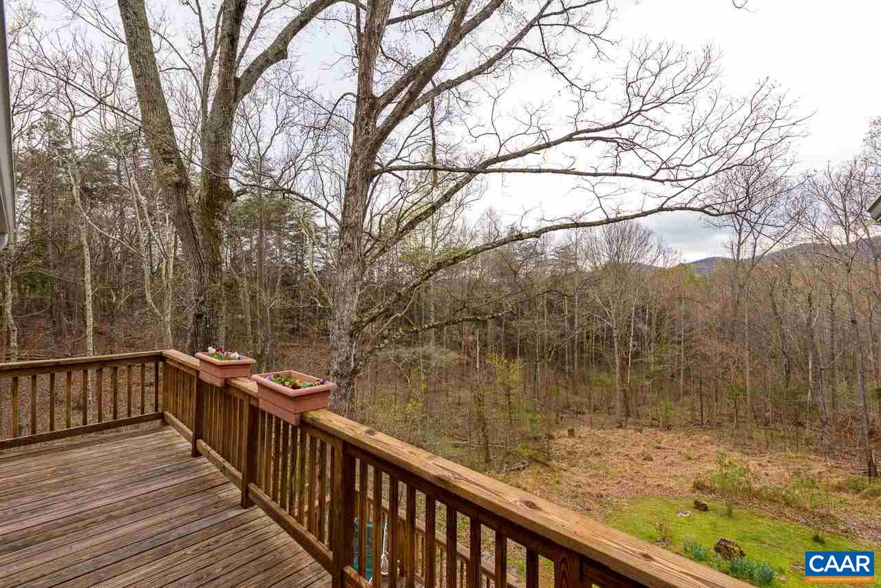 5990 Buck Ridge Road Earlysville, VA 22936 - Photo 2 of 18 a view of a balcony with wooden fence