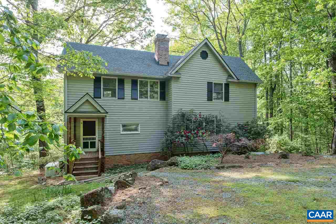 5990 Buck Ridge Road Earlysville, VA 22936 - Photo 4 of 18 a front view of a house with garden