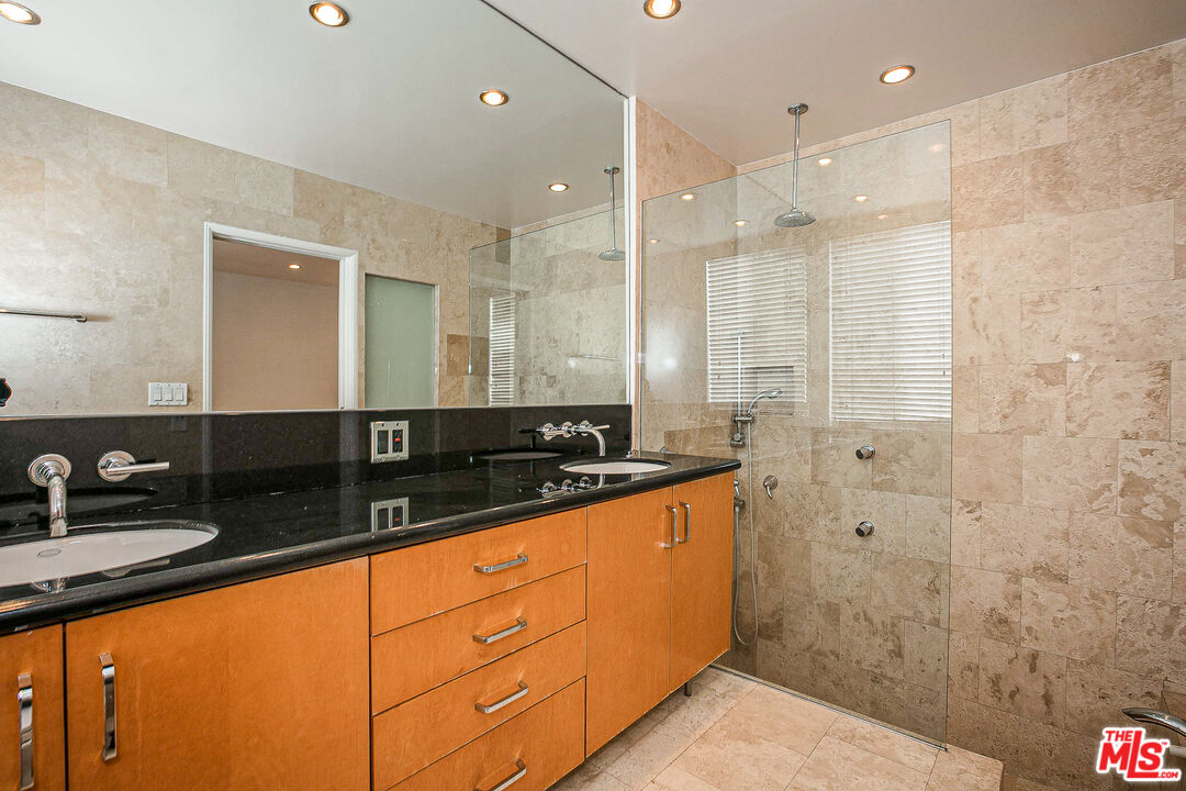 14 Privateer Street, Unit 1 Marina del Rey, CA 90292 - Photo 19 of 32 a bathroom with a double vanity sink mirror and shower
