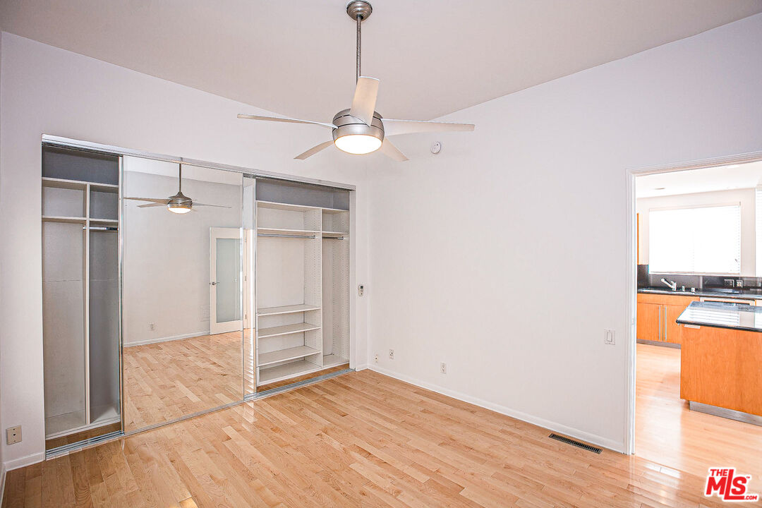 14 Privateer Street, Unit 1 Marina del Rey, CA 90292 - Photo 24 of 32 a view of an empty room with window and wooden floor