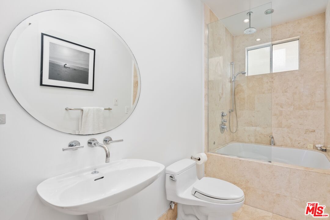 14 Privateer Street, Unit 1 Marina del Rey, CA 90292 - Photo 25 of 32 a bathroom with a sink mirror bathtub and toilet