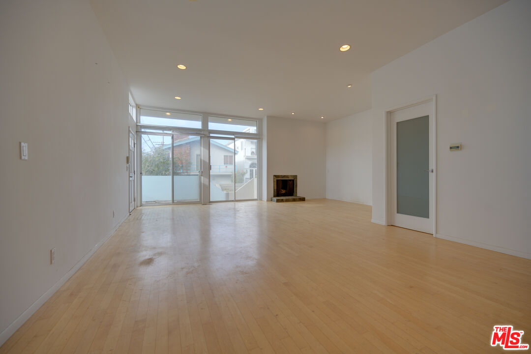 14 Privateer Street, Unit 1 Marina del Rey, CA 90292 - Photo 7 of 32 a view of empty room with wooden floor and fan