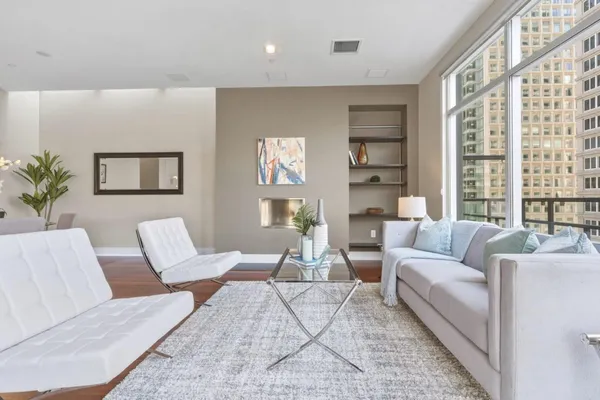 a living room with furniture and a large window