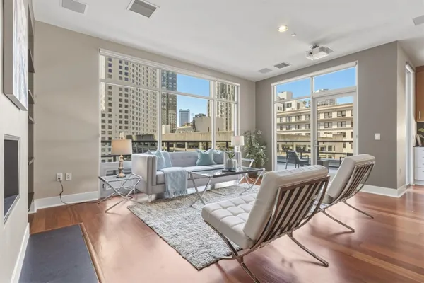 a living room with furniture and a large window