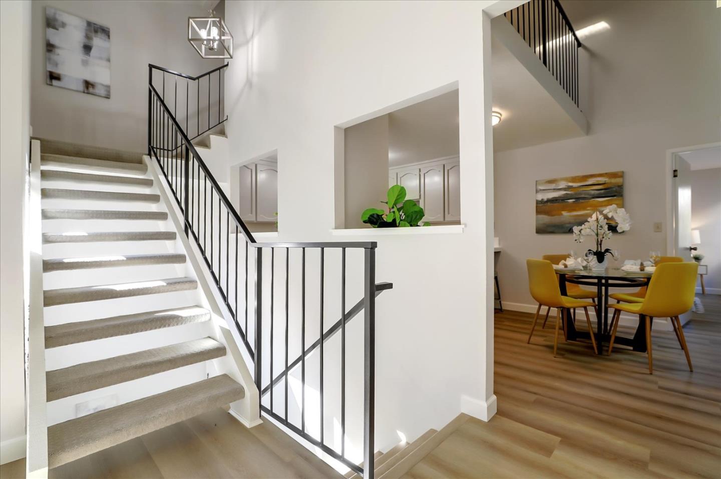 1239 Henderson Avenue, Unit R Sunnyvale, CA 94086 - Photo 13 of 42 a view of a hallway with wooden floor and stairs