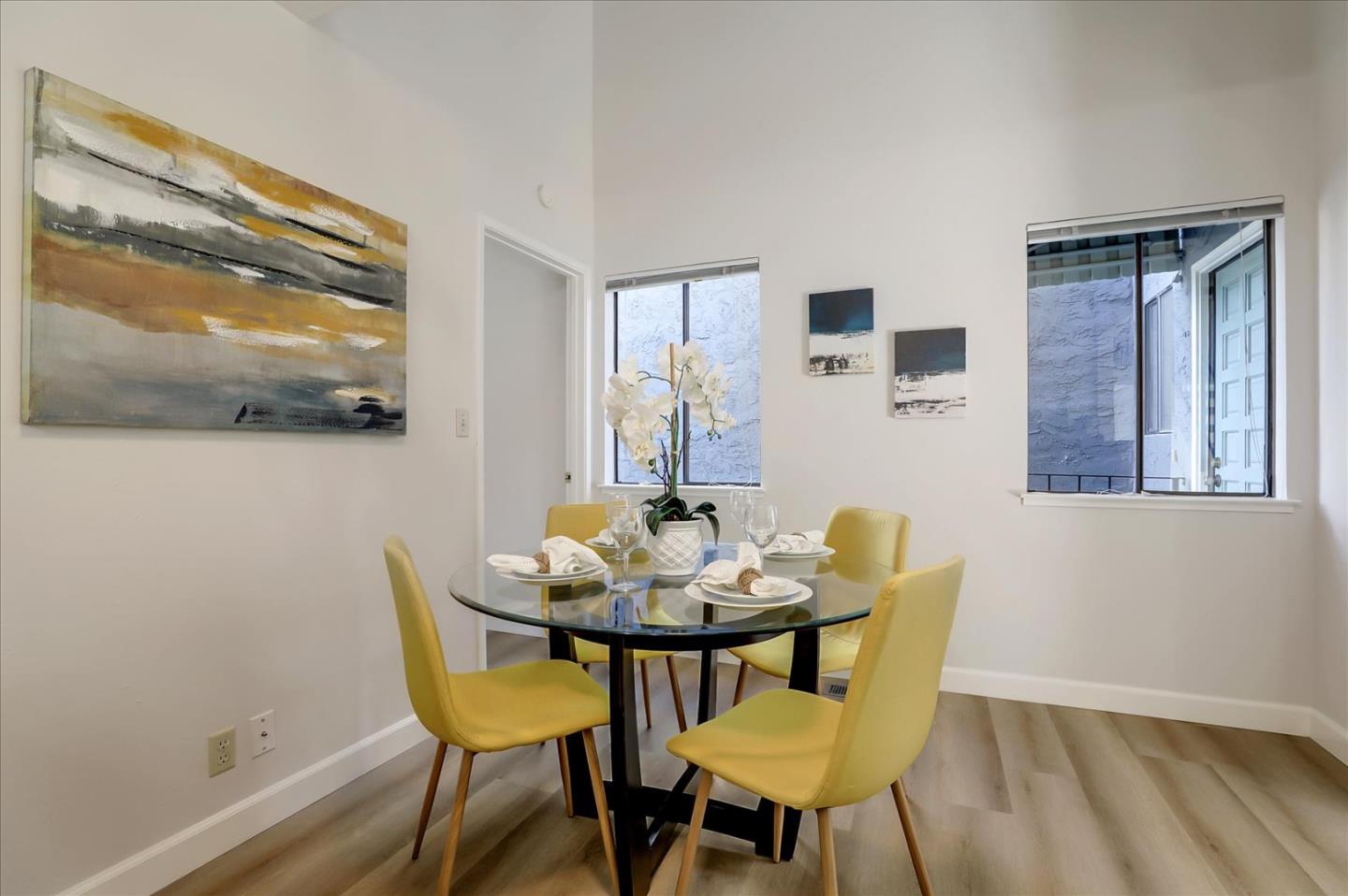 1239 Henderson Avenue, Unit R Sunnyvale, CA 94086 - Photo 21 of 42 a view of a dining room with furniture and wooden floor