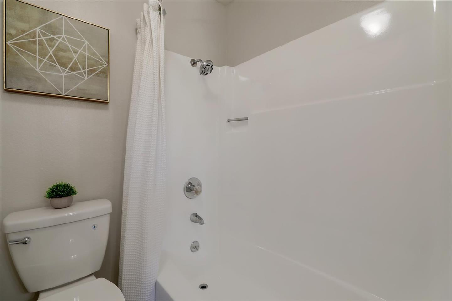 1239 Henderson Avenue, Unit R Sunnyvale, CA 94086 - Photo 25 of 42 a bathroom with a toilet and a shower