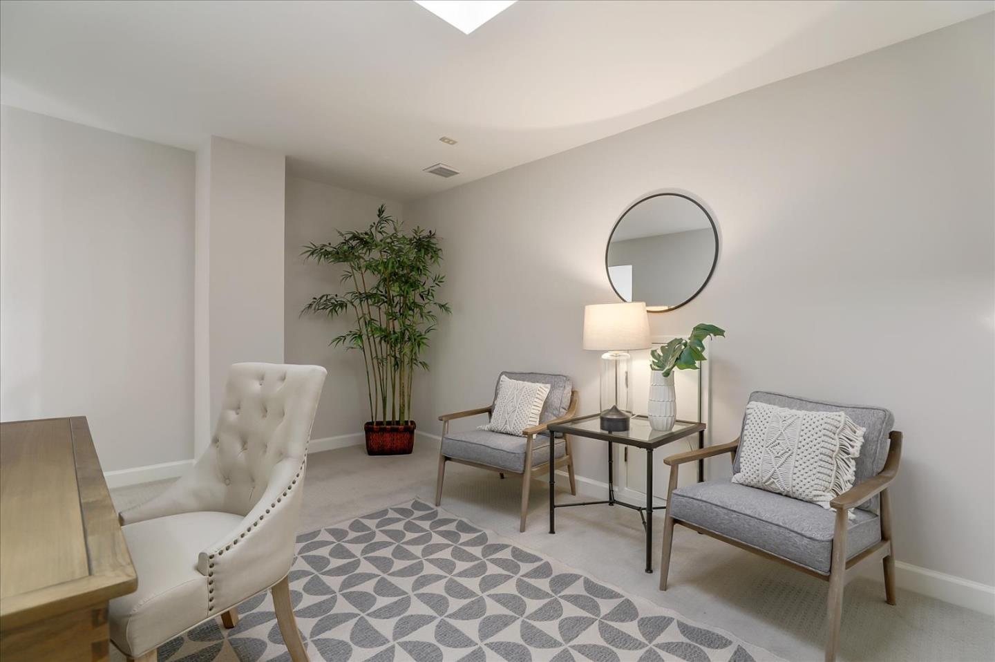 1239 Henderson Avenue, Unit R Sunnyvale, CA 94086 - Photo 29 of 42 a living room with furniture a table and a potted plant