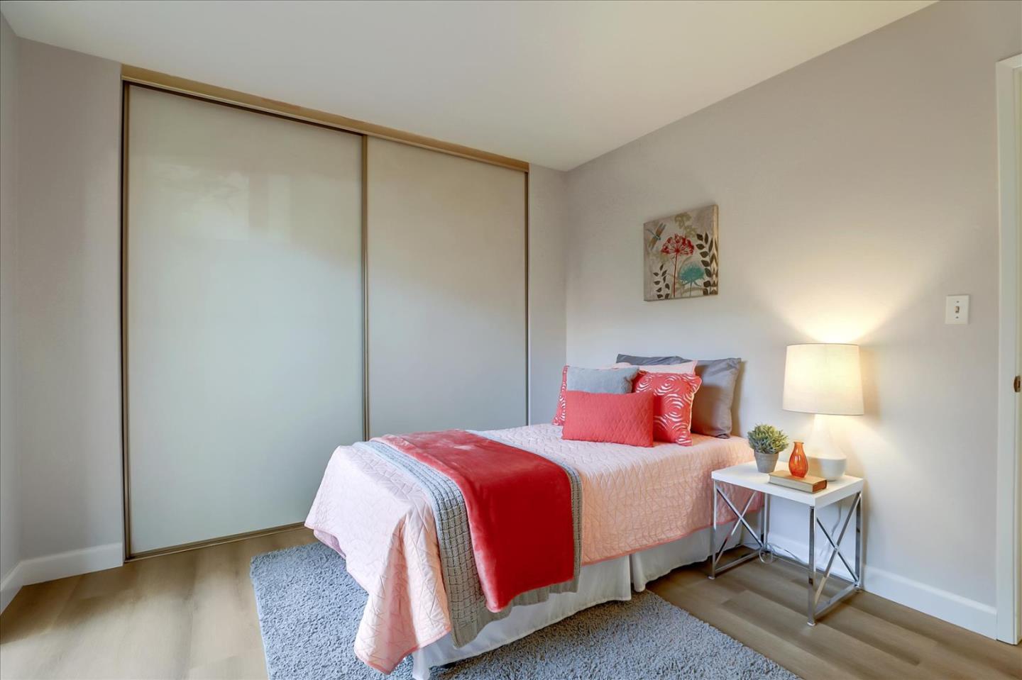 1239 Henderson Avenue, Unit R Sunnyvale, CA 94086 - Photo 31 of 42 a bedroom with a bed and wooden floor