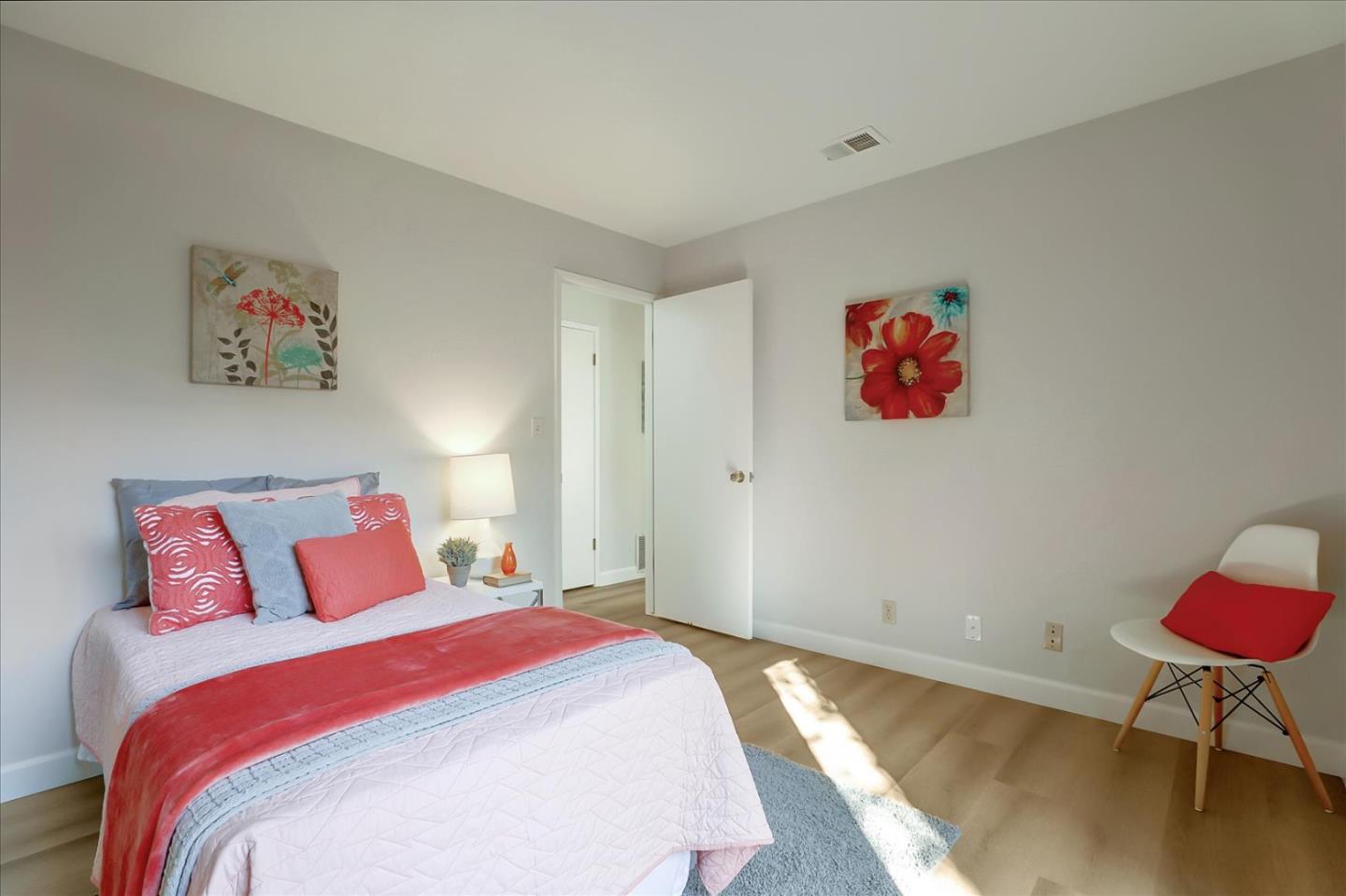 1239 Henderson Avenue, Unit R Sunnyvale, CA 94086 - Photo 32 of 42 a bedroom with a bed and a painting on the wall