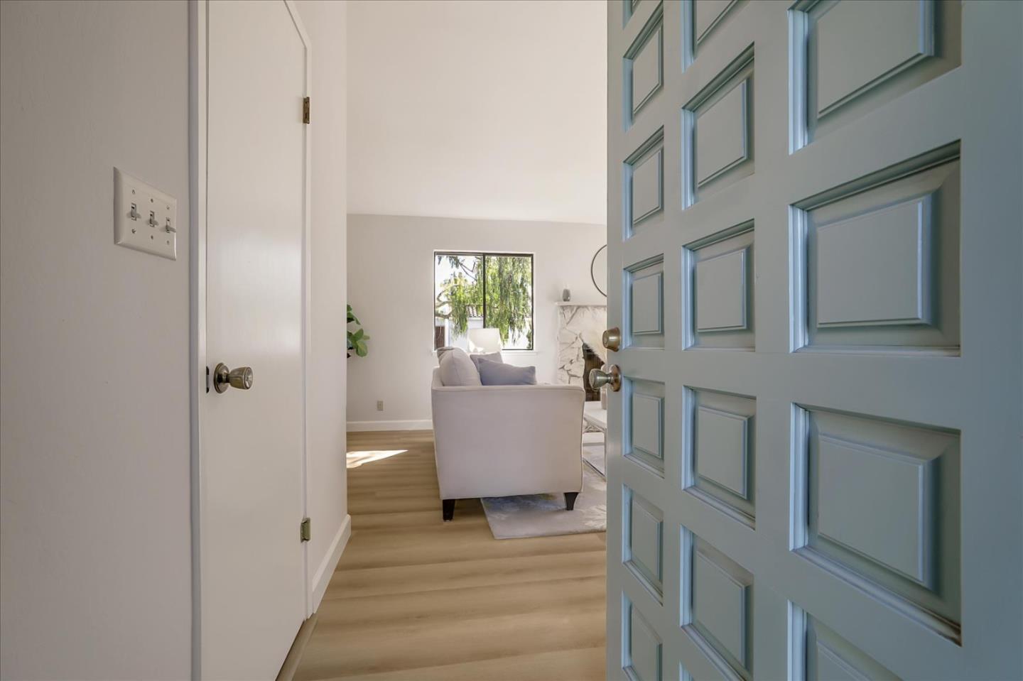 1239 Henderson Avenue, Unit R Sunnyvale, CA 94086 - Photo 4 of 42 a hallway with white cabinets and wooden floor