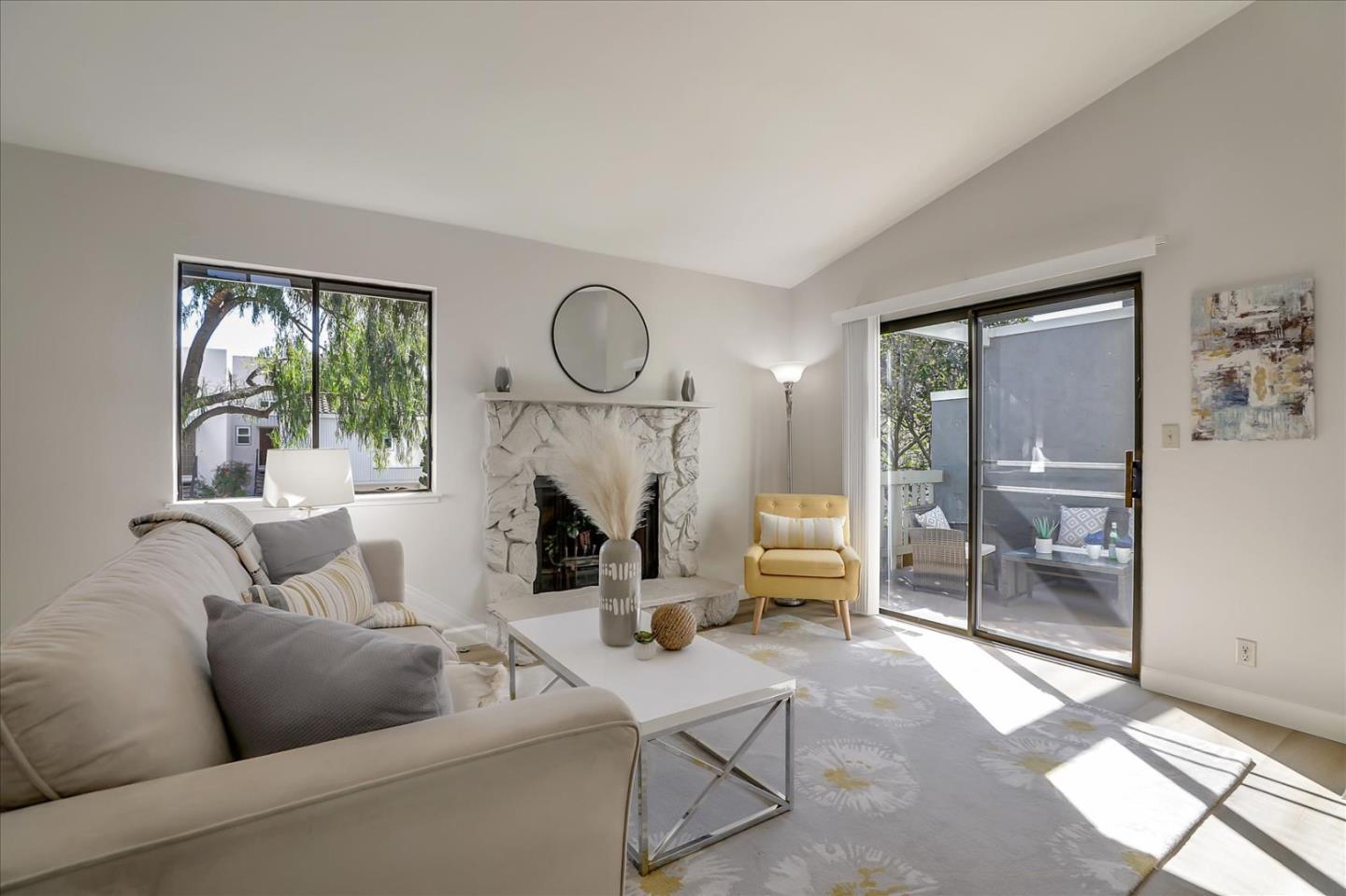 1239 Henderson Avenue, Unit R Sunnyvale, CA 94086 - Photo 5 of 42 a living room with furniture a window and a fireplace