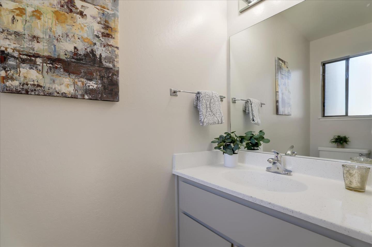 1239 Henderson Avenue, Unit R Sunnyvale, CA 94086 - Photo 6 of 42 a bathroom with a sink and a mirror