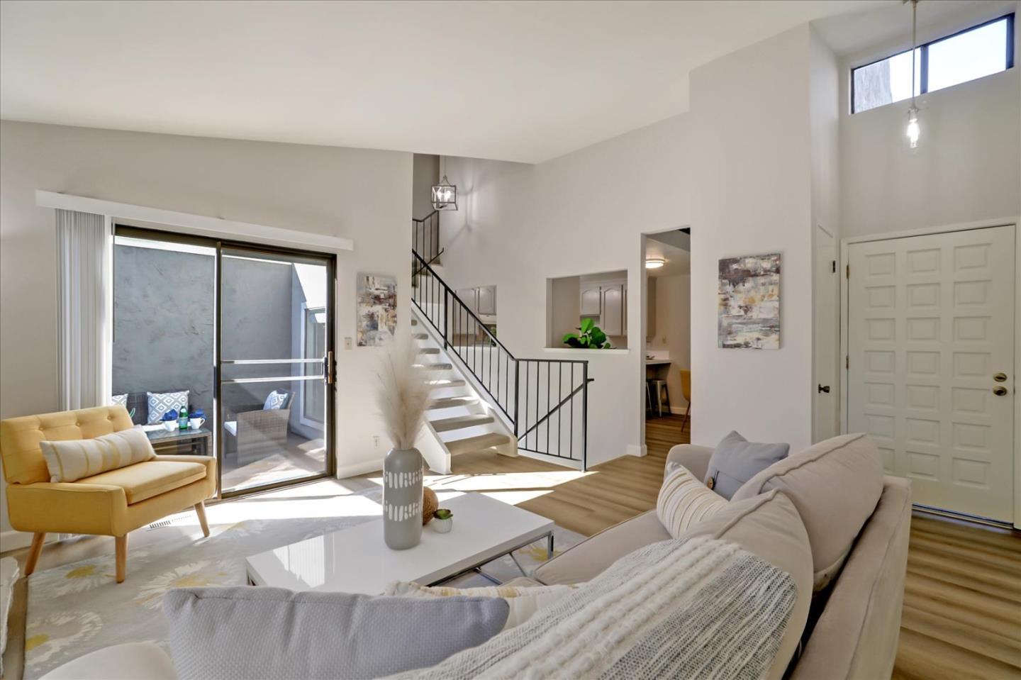 1239 Henderson Avenue, Unit R Sunnyvale, CA 94086 - Photo 7 of 42 a living room with furniture and a floor to ceiling window
