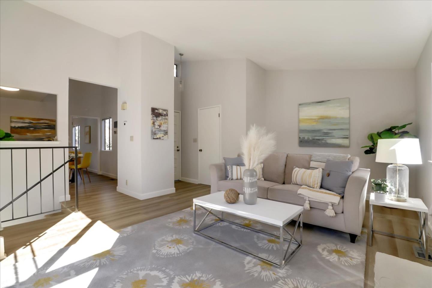 1239 Henderson Avenue, Unit R Sunnyvale, CA 94086 - Photo 8 of 42 a living room with furniture and a table