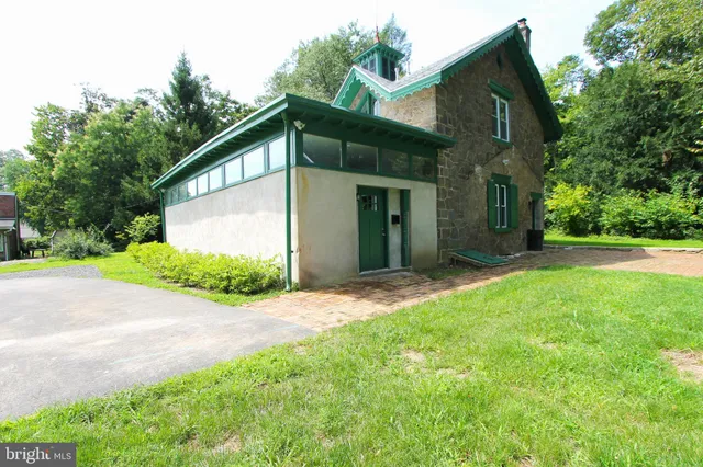 a view of a house with a yard and garage