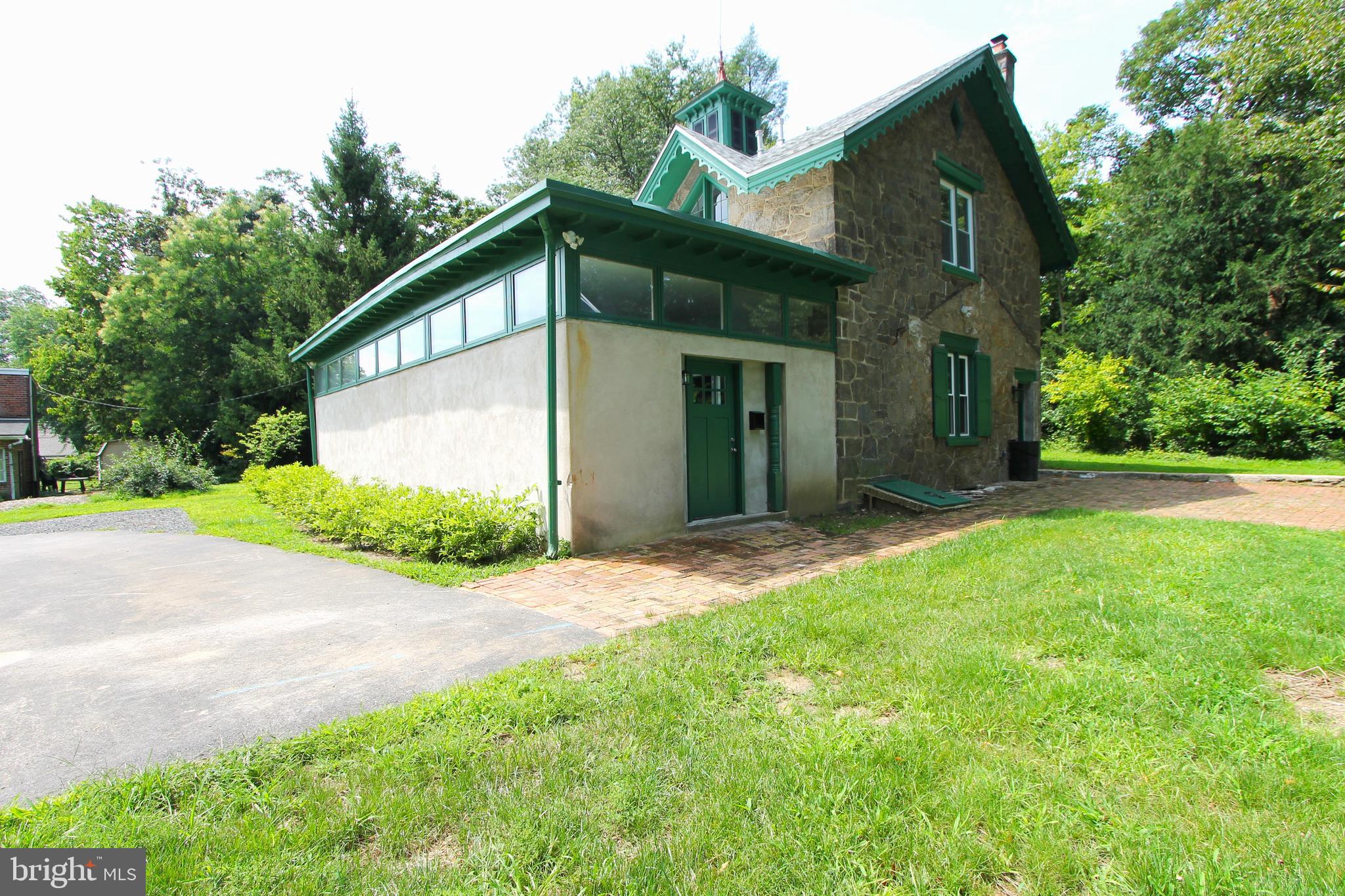 a view of a house with a yard and garage