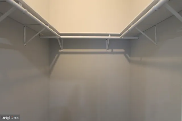a view of an empty walk in closet