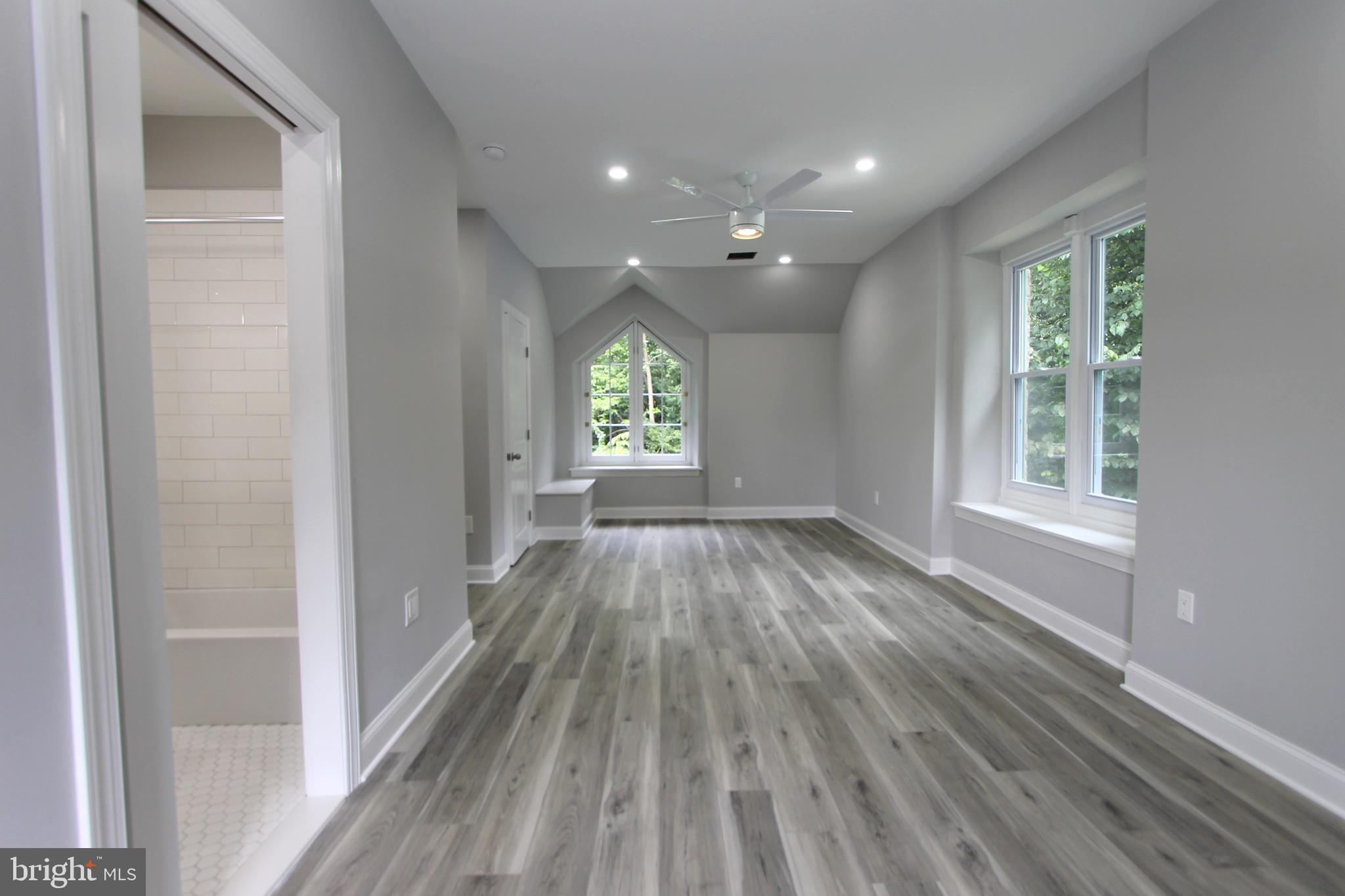 5925-31 Devon Place Philadelphia, PA 19138 - Photo 21 of 27 wooden floor in an empty room with a window