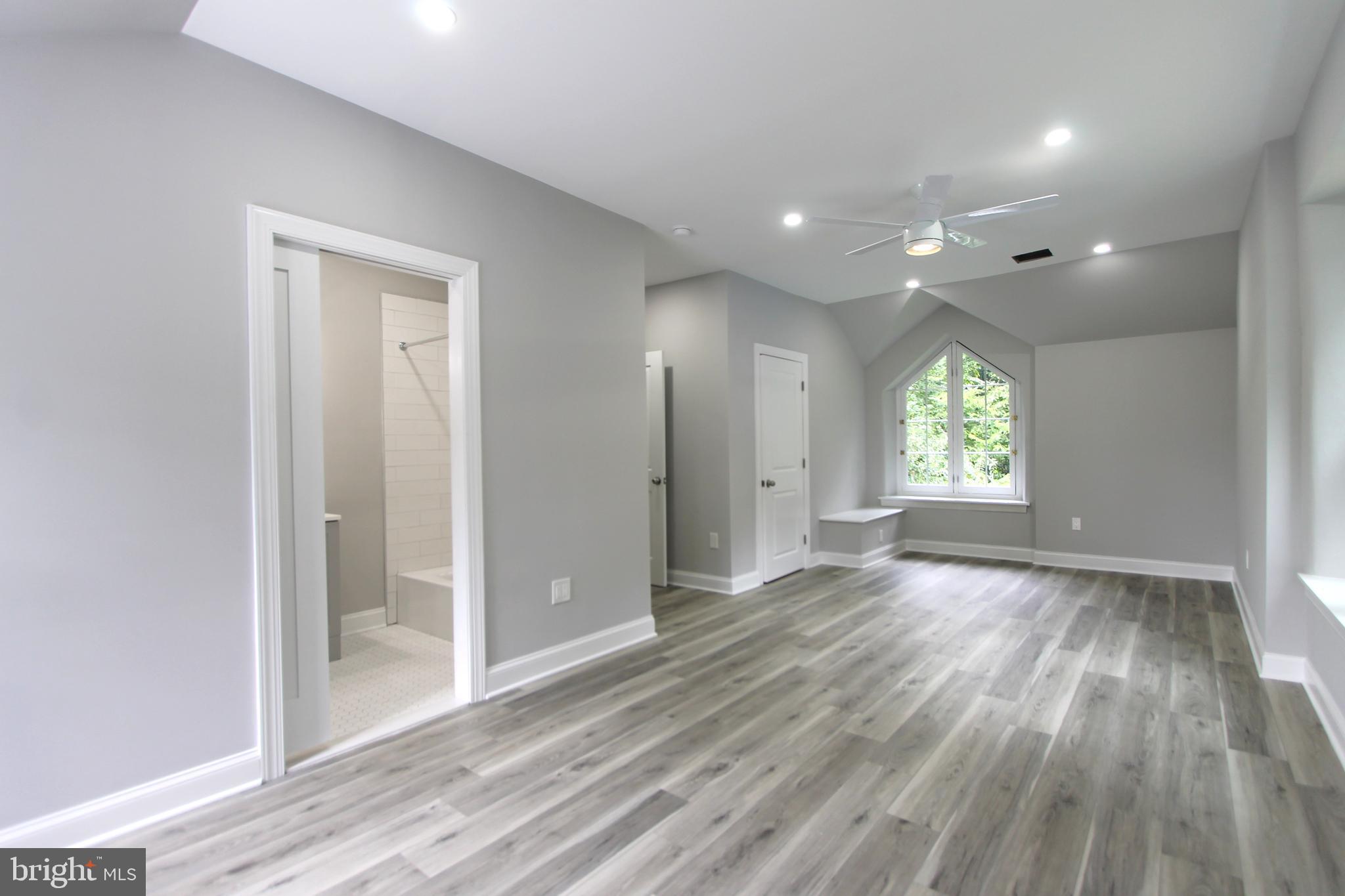 5925-31 Devon Place Philadelphia, PA 19138 - Photo 22 of 27 an empty room with wooden floor and windows