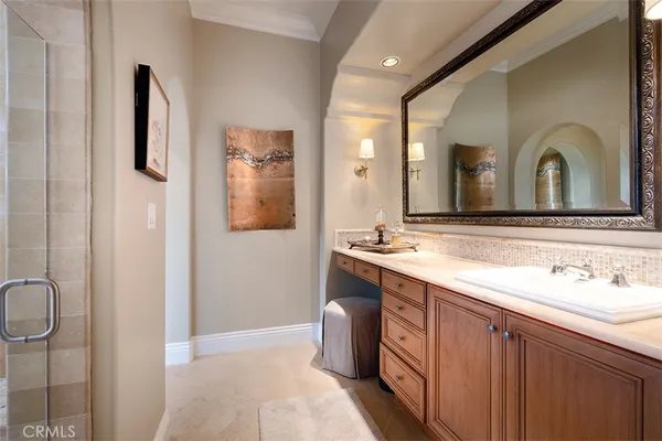 a spacious bathroom with a double vanity sink mirror and toilet