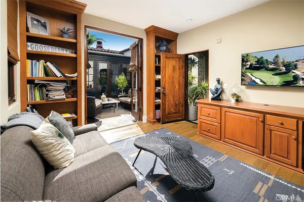 a living room with furniture a rug and a window