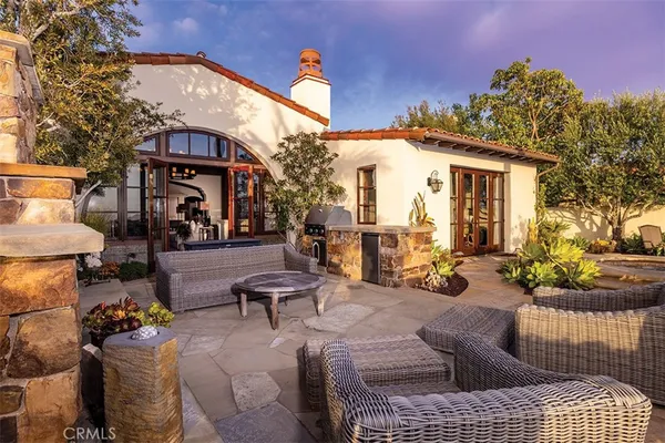 a view of a patio with couches and potted plants