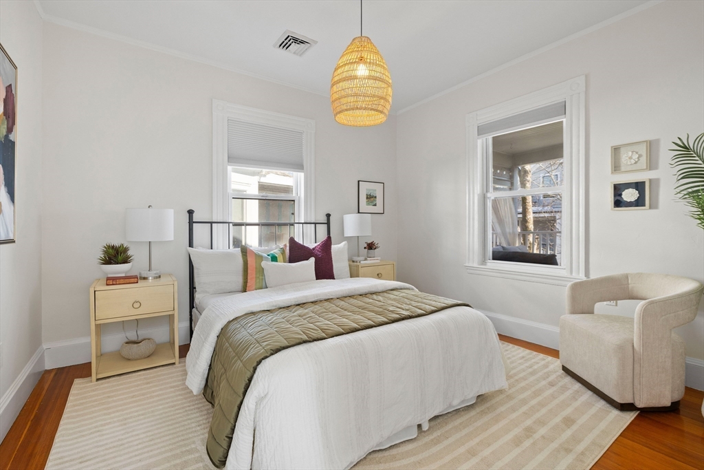 112 Franklin Street, Unit 3 Brookline, MA 02445 - Photo 11 of 16 a bedroom with a bed and a window