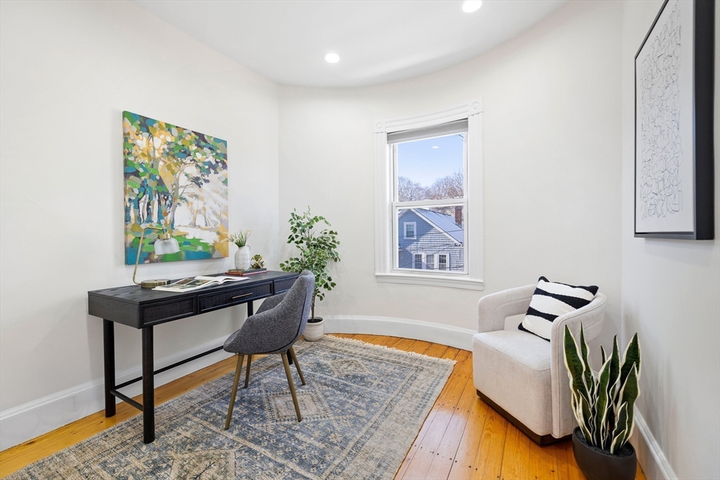 112 Franklin Street, Unit 3 Brookline, MA 02445 - Photo 12 of 16 a living room with furniture and a rug