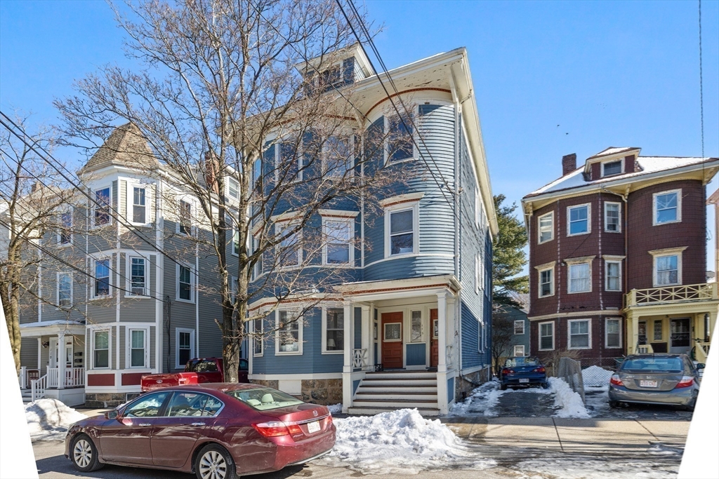 112 Franklin Street, Unit 3 Brookline, MA 02445 - Photo 14 of 16 a front view of a residential apartment building with a yard