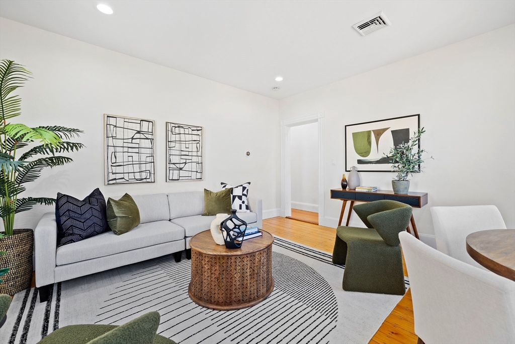 112 Franklin Street, Unit 3 Brookline, MA 02445 - Photo 2 of 16 a living room with furniture and a rug