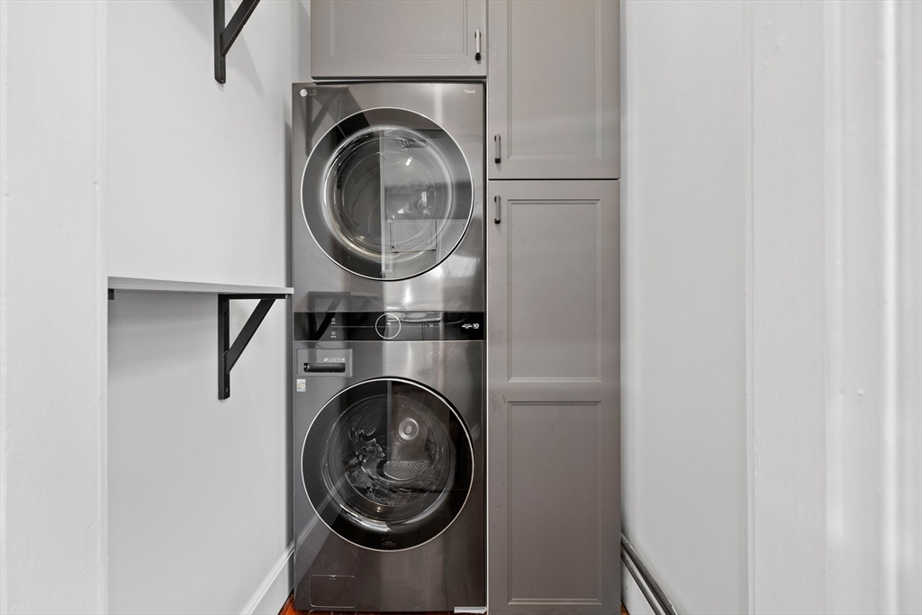 112 Franklin Street, Unit 3 Brookline, MA 02445 - Photo 6 of 16 a close view of utility and utility room with washer and dryer