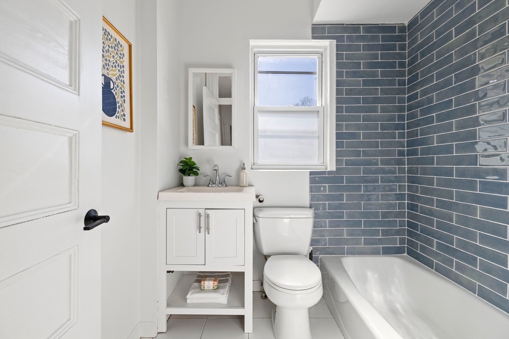 112 Franklin Street, Unit 3 Brookline, MA 02445 - Photo 10 of 16 a bathroom with a toilet a sink and a shower