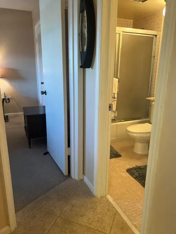 a bathroom with a glass door shower