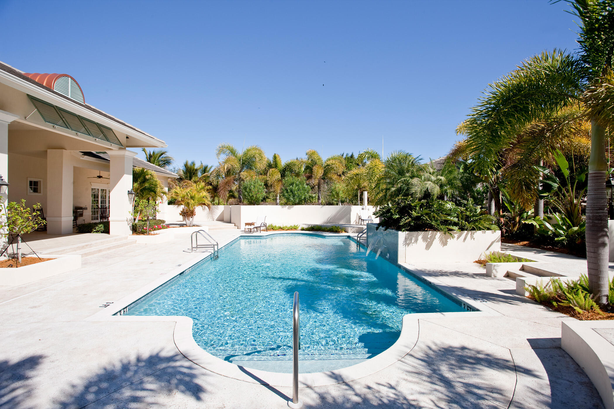 9025 Somerset Bay Lane, Unit 302 Vero Beach, FL 32963 - Photo 23 of 30 a view of a swimming pool with a patio