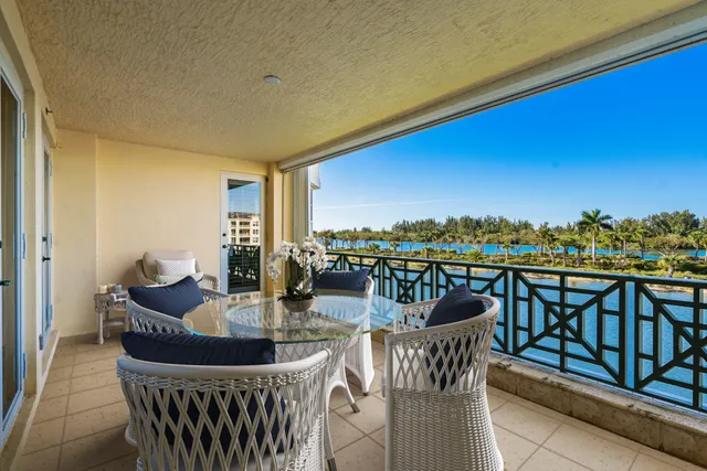 a view of a chairs and table in patio
