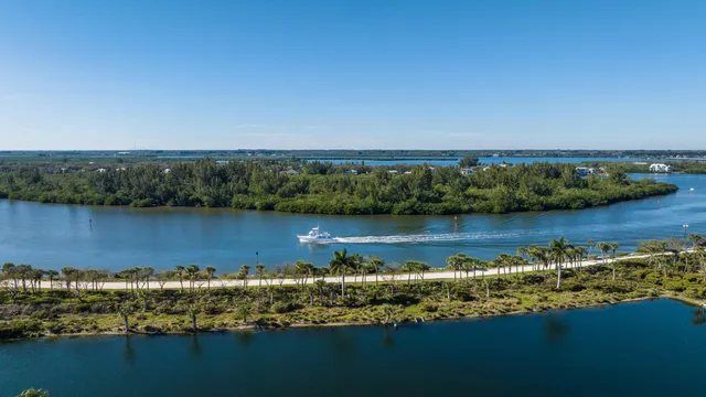 an aerial view of a houses with a lake view