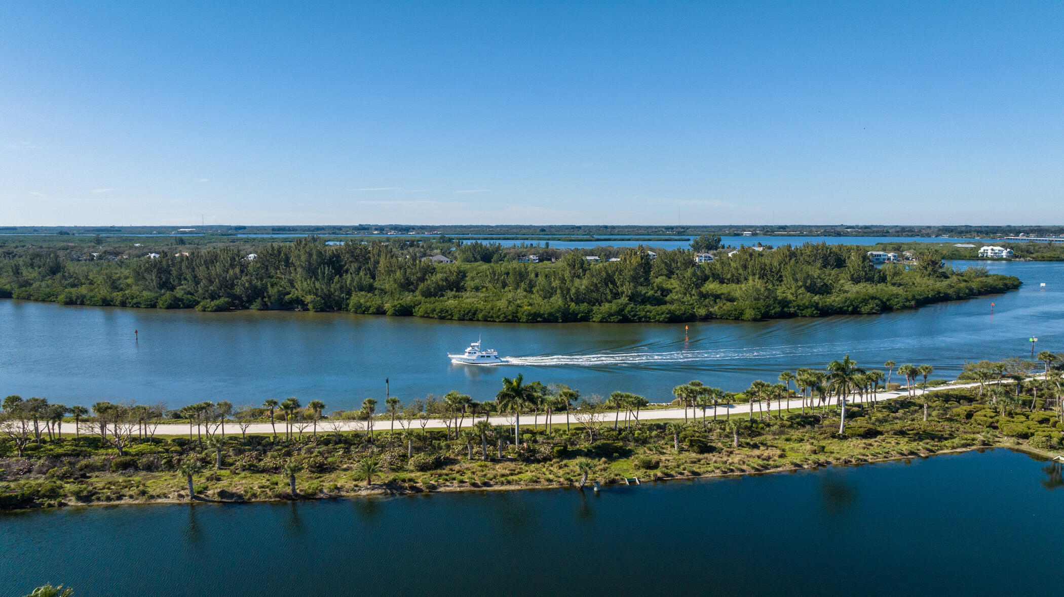 9025 Somerset Bay Lane, Unit 302 Vero Beach, FL 32963 - Photo 6 of 30 an aerial view of a houses with a lake view