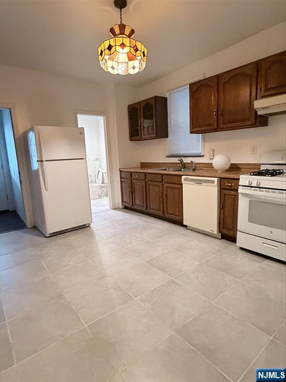 242 Grant Avenue, Unit 2 East Newark, NJ 07029 - Photo 2 of 9 a kitchen with stainless steel appliances granite countertop a stove and a microwave