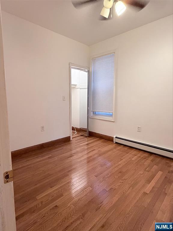 242 Grant Avenue, Unit 2 East Newark, NJ 07029 - Photo 7 of 9 wooden floor in an empty room