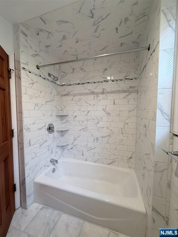 242 Grant Avenue, Unit 2 East Newark, NJ 07029 - Photo 9 of 9 a bathroom with a shower and a bath tub