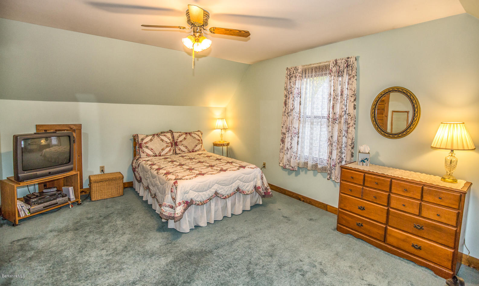 333 South County Road Florida, MA 01343 - Photo 18 of 32 a spacious bedroom with a bed a dresser and potted plants on the dresser